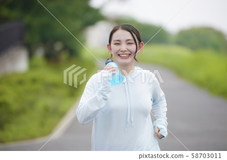 Young woman jogging exercise Young woman jogging exercise 58703011