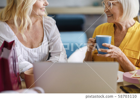 Happy mother and daughter looking aech other 58703110