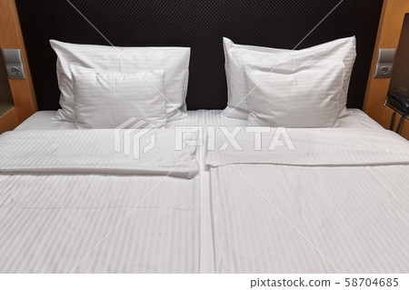 Hotel bed closeup Hotel bed closeup 58704685