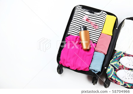 Plastic hardshell suitcase packed with casual 58704966