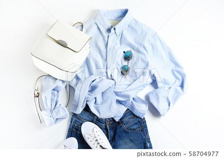Fashionable clothing set lying on white 58704977