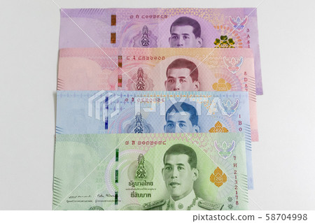 Assorted currency notes of Thailand Baht on white 58704998
