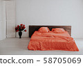 the Interior of the white room with a bed with red 58705069