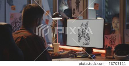 Graphic designer drawing video game art Graphic designer drawing video game art 58705111