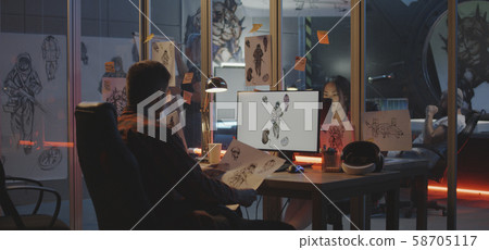 Graphic designer drawing video game art Graphic designer drawing video game art 58705117