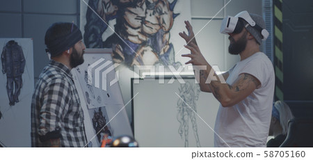 Video game developers brainstorming Video game developers brainstorming 58705160