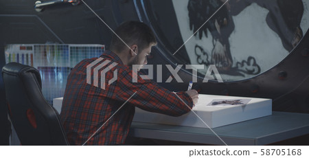 Graphic designer drawing video game art 58705168