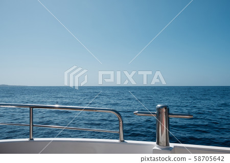 ocean and blue sky / sea view horizon behind boat ocean and blue sky / sea view horizon behind boat 58705642