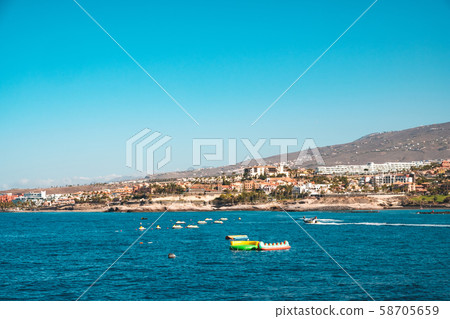 group of jet ski in ocean with hotels at coast in group of jet ski in ocean with hotels at coast in 58705659