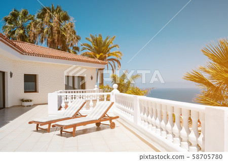 sunny terrace with sun beds of ocean view house sunny terrace with sun beds of ocean view house 58705780