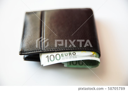 Currency in the wallet and on the table. Currency in the wallet and on the table. 58705789