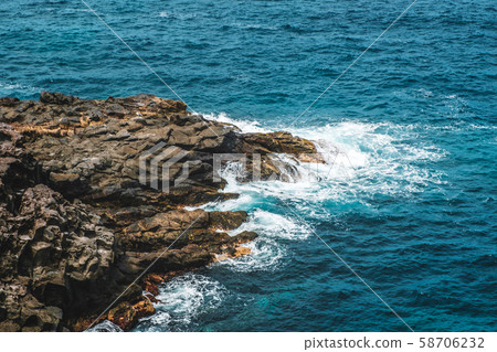 black rock in surf, cliff in oceran - rocky coast black rock in surf, cliff in oceran - rocky coast 58706232