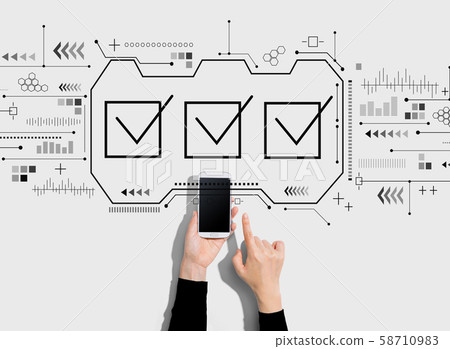 Checklist with person using a smartphone Checklist with person using a smartphone 58710983