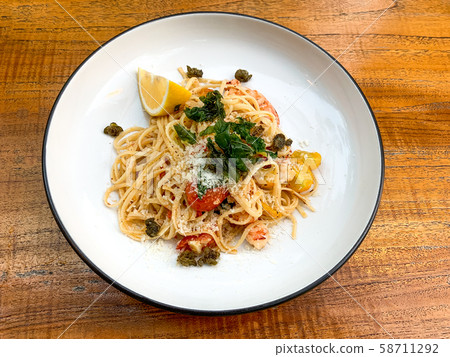 Shrimp linguine, green garnish, cherry tomatoes, 58711292