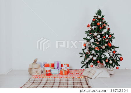 Christmas tree with presents of toys with a Garland of new year Christmas tree with presents of toys with a Garland of new year 58712304