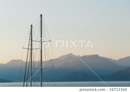Ship mast on a background of blue sunset sky and 58713308