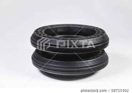 A pair of new thrust bearings absorber car on a gray background. The concept of new car parts and 58715302