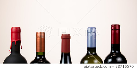 Set of collars red wine bottles isolated on white background 58716570