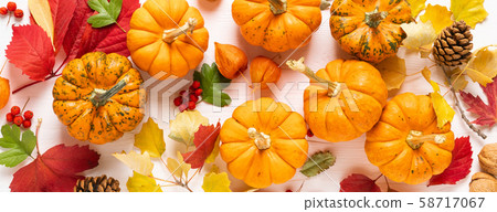 Festive autumn pumpkins decor with fall leaves Festive autumn pumpkins decor with fall leaves 58717067
