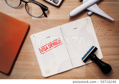 visa and passport with denied stamp on a document top view in immigration. travel immigration stamp and tourism concept 58718246