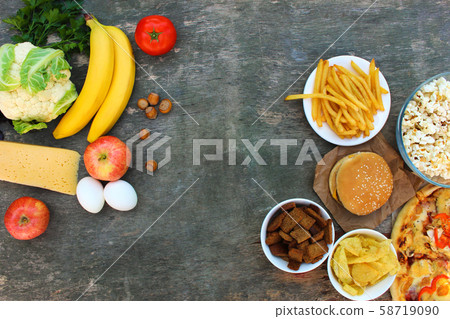 Fastfood and healthy food on old wooden 58719090