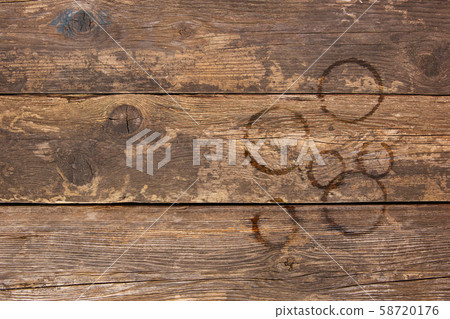Trail from cups of coffee on old wooden Trail from cups of coffee on old wooden 58720176