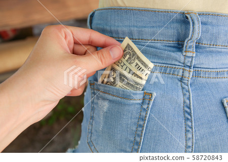 Close up of thief stealing money from pocket. Close up of thief stealing money from pocket. 58720843