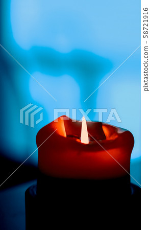 Red holiday candle on dark background, luxury 58721916