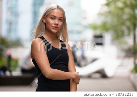 Portrait of a beautiful young woman fitness model looking at camera Portrait of a beautiful young woman fitness model looking at camera 58722235