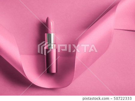 Luxury lipstick and silk ribbon on pink holiday 58722333