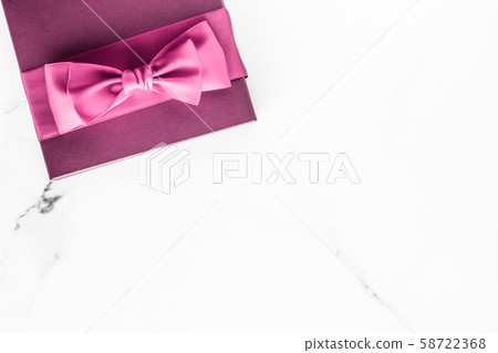 Pink gift box with silk bow on marble background, Pink gift box with silk bow on marble background, 58722368