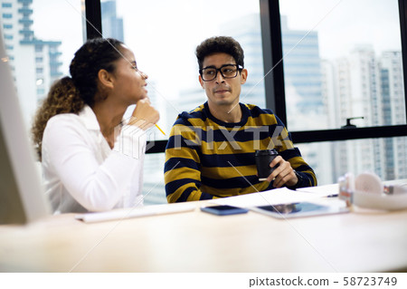 Business man and Business woman meeting and discuss for work in the offices. Business man and Business woman meeting and discuss for work in the offices. 58723749