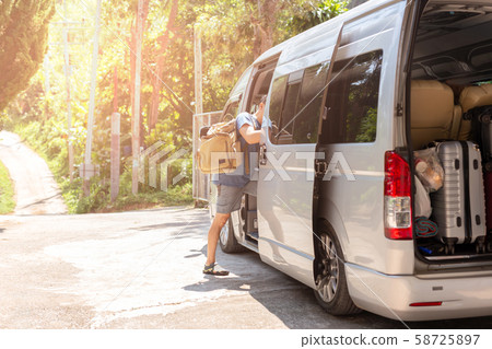 Passenger boarding on travel van with carry bag and bottle water. Passenger boarding on travel van with carry bag and bottle water. 58725897
