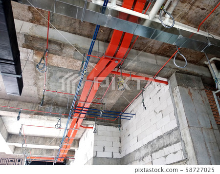 Electrical conduit, cable tray and aircond pipes as part of services above ceiling installed at the construction. Electrical conduit, cable tray and aircond pipes as part of services above ceiling installed at the construction. 58727025