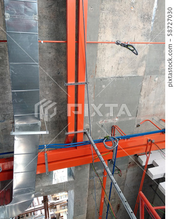 Electrical conduit, cable tray and aircond pipes as part of services above ceiling installed at the construction.  58727030