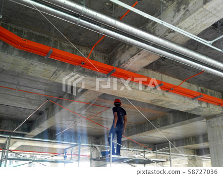 Electrical conduit, cable tray and aircond pipes as part of services above ceiling installed at the construction.  58727036