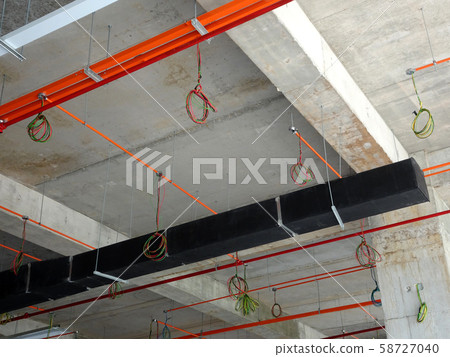 Electrical conduit, cable tray and aircond pipes as part of services above ceiling installed at the construction. Electrical conduit, cable tray and aircond pipes as part of services above ceiling installed at the construction. 58727040