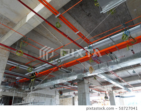 Electrical conduit, cable tray and aircond pipes as part of services above ceiling installed at the construction. Electrical conduit, cable tray and aircond pipes as part of services above ceiling installed at the construction. 58727041