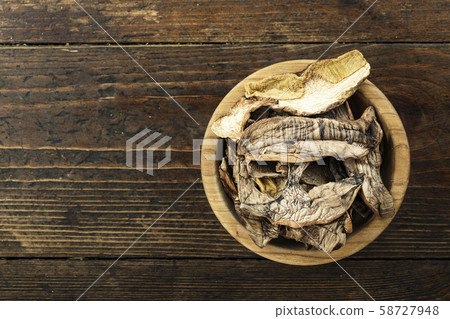 dried porcini mushrooms in a plate 58727948