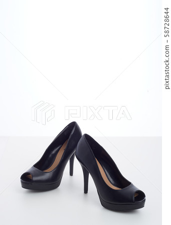 black high-heeled shoes on white black high-heeled shoes on white 58728644