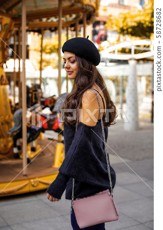 woman dressed in retro style walking around the city. woman dressed in retro style walking around the city. 58728682