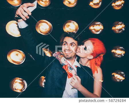 social media playful couple selfie smartphone 58729284