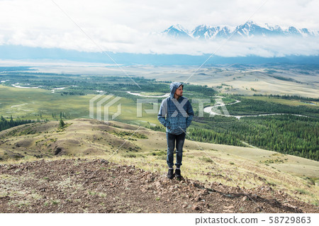 Relaxing man in Kurai steppe on North-Chui ridge Relaxing man in Kurai steppe on North-Chui ridge 58729863