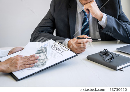 Bribery and corruption concept, bribe in the form Bribery and corruption concept, bribe in the form 58730630