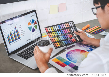 Young creative graphic designer working on project 58731314