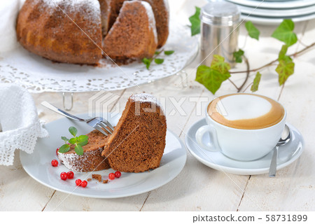 Freshly baked ring-shaped cake with chocolate, so called 'Gugelhupf' in Austria and Germany Freshly baked ring-shaped cake with chocolate, so called 'Gugelhupf' in Austria and Germany 58731899