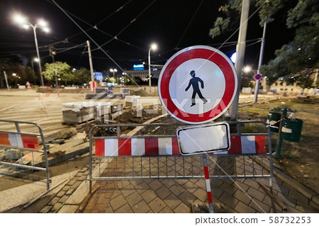 Urban construction site with warning signs 58732253