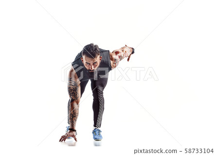 One caucasian man young sprinter runner running in silhouette studio on white background. One caucasian man young sprinter runner running in silhouette studio on white background. 58733104