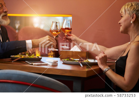 Senior couple date in restaurant. Romantic atmosphere 58733253