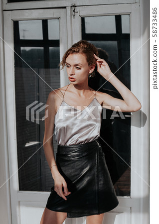 portrait of a beautiful fashionable woman on a dark background 58733486